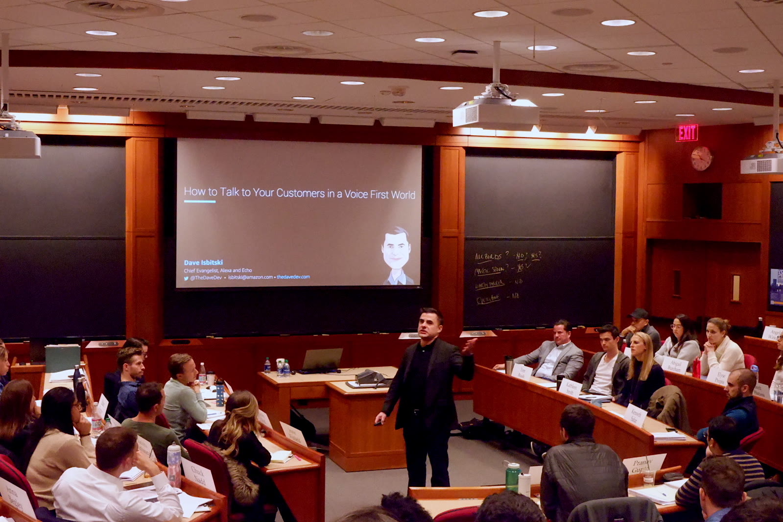 Dave Isbitski teaching a Harvard Business School classroom beneath the title How to Talk to Your Customers in a Voice First World
