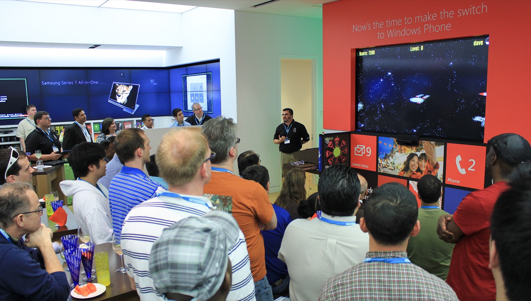 Dave Isbitski demonstrating a custom space game he built for Windows 8 to a packed Microsoft Store audience