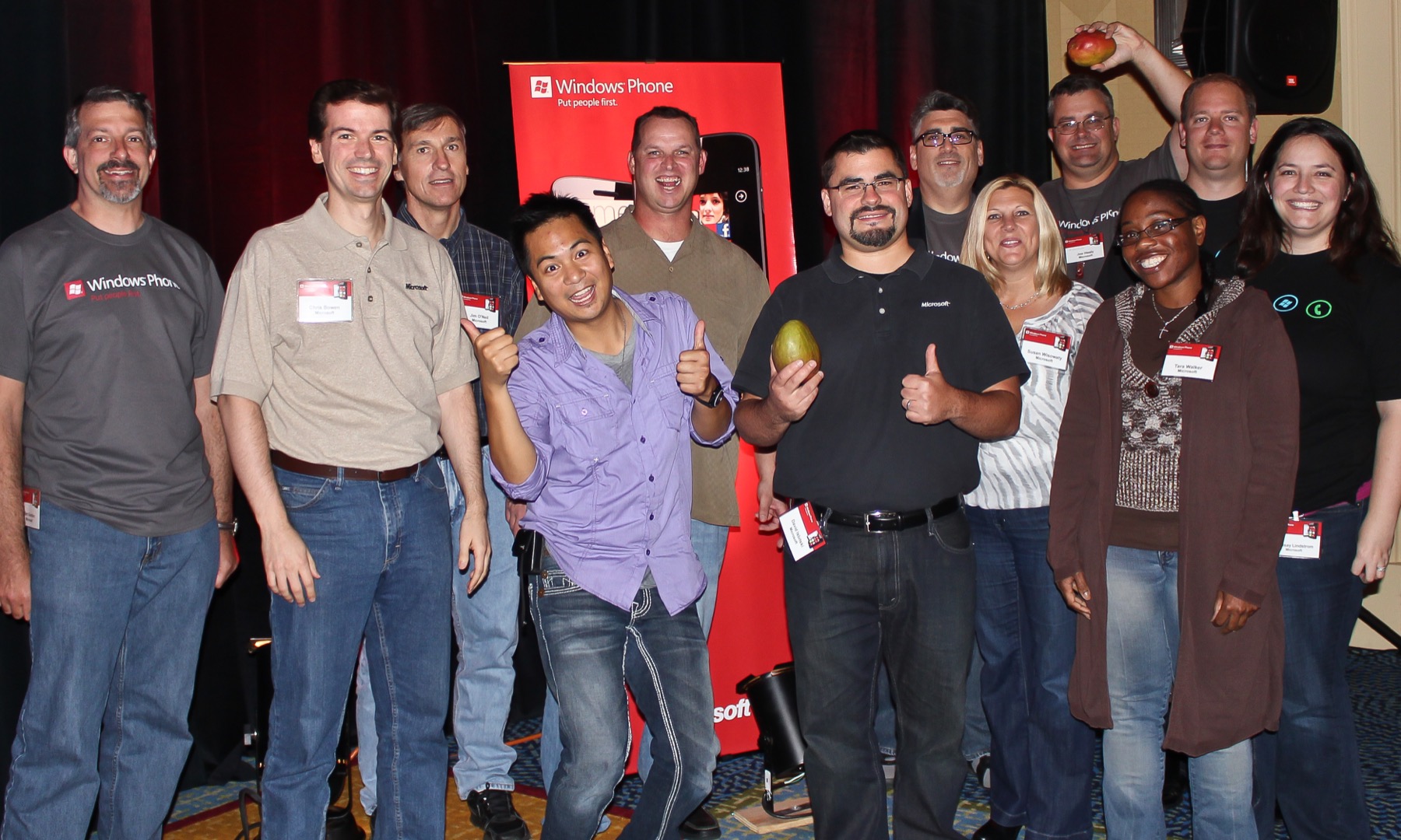 Dave Isbitski standing with the Microsoft and community event team in front of a Windows Phone display